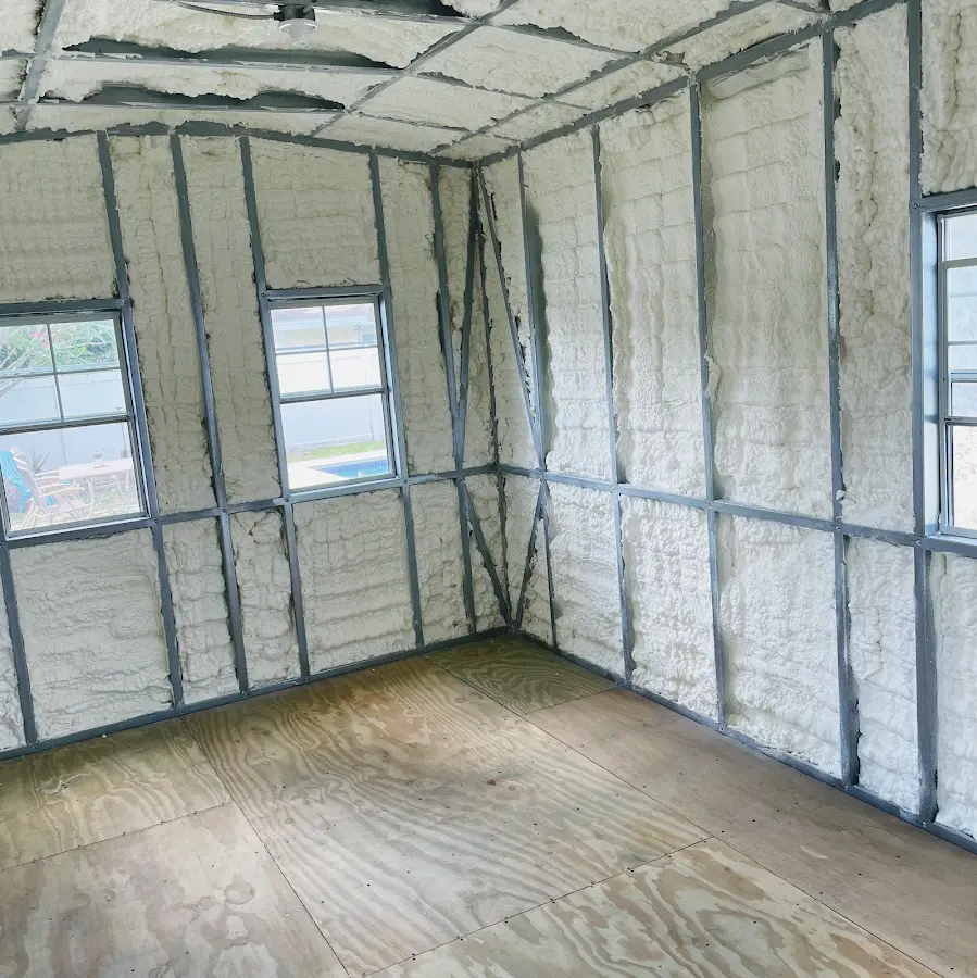 Closed-cell spray foam insulation applied to wall cavities in a residential project in Smithfield
